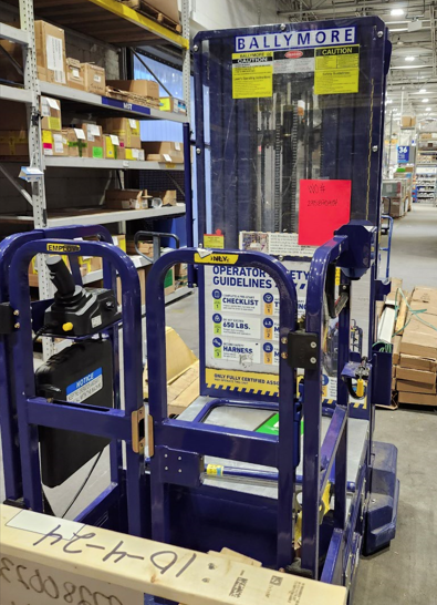 Personnel stock lift hinge repair in a warehouse